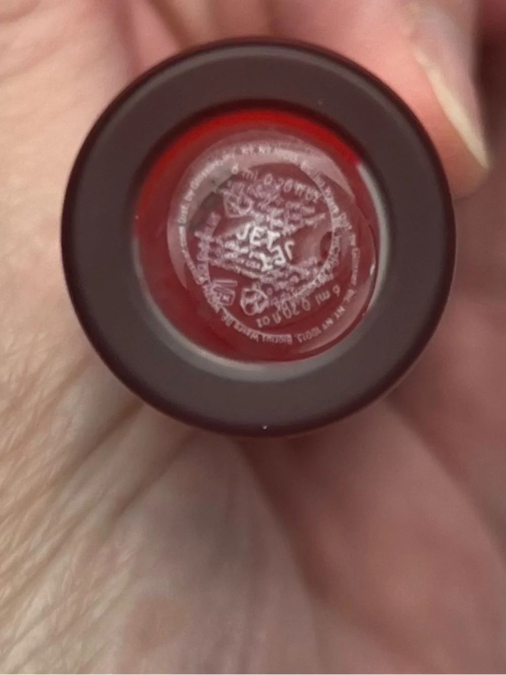 Glossier G suit, soft touch lip cream, shade JET